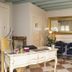 Cà Furlan Venice lobby with checkered floor, white desk, blue chairs and gold-framed mirror