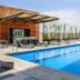 Hilton Garden Inn Aguascalientes outdoor pool with loungers and a shaded seating area