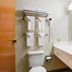 Quality Inn Rosebud Casino bathroom with sink, toilet, mirror, and towel rack in Mission