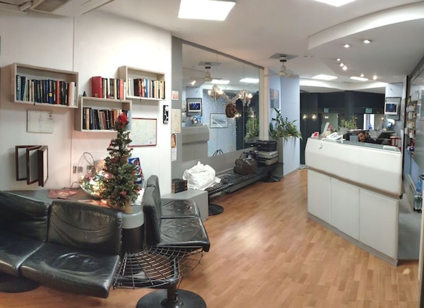 Giappone Inn Parking Hotel in Livorno lobby with seating, reception desk, and wood flooring