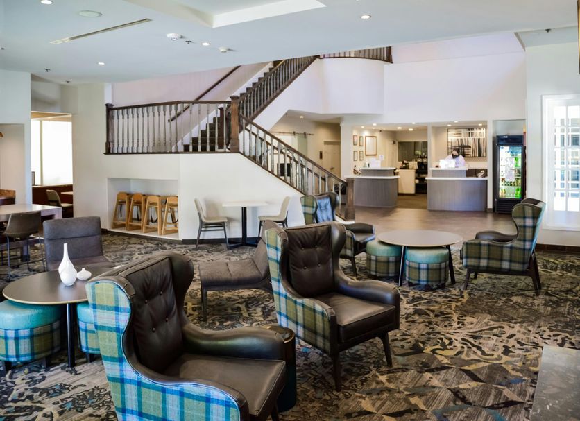 Residence Inn by Marriott La Mirada Buena Park lobby with seating area, staircase, and reception desk