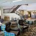 Residence Inn by Marriott La Mirada Buena Park lobby with seating area, staircase, and reception desk