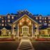 Inn at Bellefield / Hyde Park hotel entrance with lit portico and landscaped drive in Hyde Park