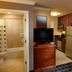 TownePlace Suites by Marriott Houston Intercontinental Airport suite with kitchenette, desk, and bathroom in Houston