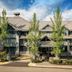 Glacier Lodge in Whistler exterior with tall trees and chalet-style lodge entrance