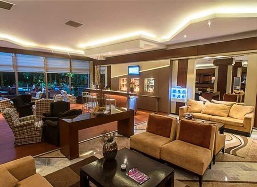 Anemon Ege Hotel in Izmir lobby lounge with seating area, coffee tables, and warm ambient lighting