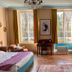 YXIE - manoir des arts guest room in Villeblevin with tall windows, desk, bed and fireplace