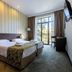 Citrus Hotel Tbilisi guest room with twin beds, balcony doors and city view