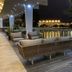Hotel Antofagasta in Antofagasta: night terrace with lounge seating beside a reflecting pool and palm trees