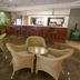 C Hotel Tiberias lobby lounge with wicker chairs and bar seating in Tiberias