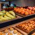 Holiday Inn Express Nürnberg-Schwabach breakfast buffet with bananas, oranges, apples and pastries