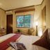 The Jayakarta Yogyakarta Hotel & Spa guest room with bed, TV, desk, and window view in Yogyakarta