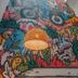 Supertramp Hostel Machupicchu in Machu Picchu, colorful mural wall with woven pendant lights