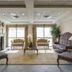 Monte Carlo Inn Oakville Suites in Oakville: elegant lobby seating area with fireplace and large windows