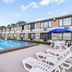 Quality Inn Pensacola North in Pensacola with outdoor pool and lounge chairs