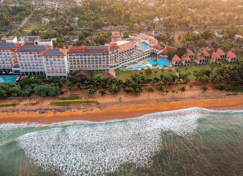 Turyaa Kalutara in Wadduwa, beachfront resort with ocean waves, palm trees and pool views
