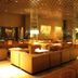 Gunma Royal Hotel in Maebashi lounge with brown sofas, warm lighting, and mirrored ceiling