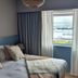 Doonmore Hotel Inishbofin guest room with twin beds and a window view of the water
