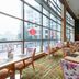 New Century Grand Hotel Kaifeng restaurant with large windows and city views in Kaifeng