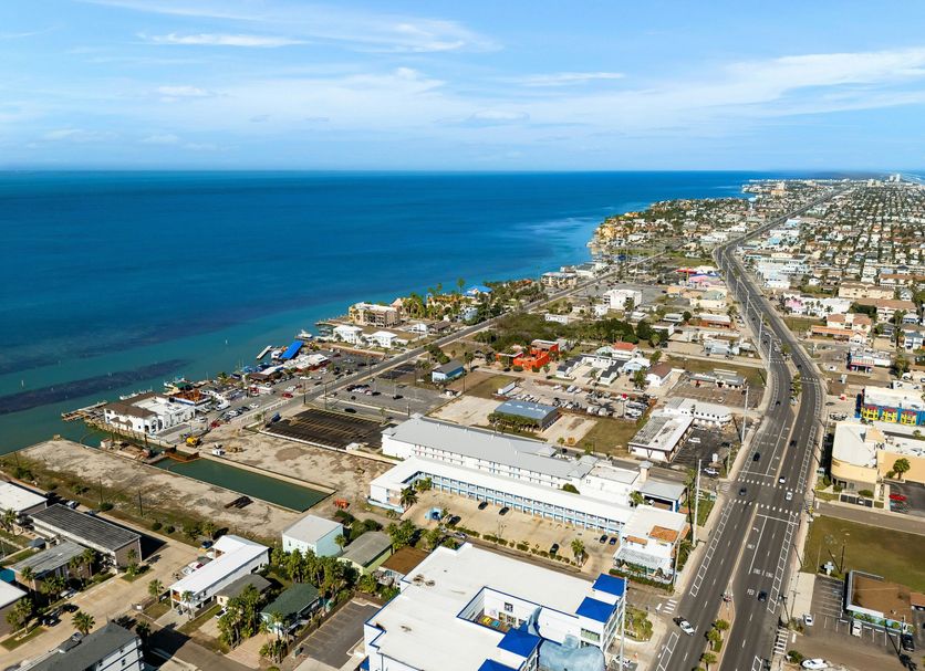 Home2 Suites by Hilton South Padre Island aerial view of coastline and ocean beside the road