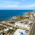 Home2 Suites by Hilton South Padre Island aerial view of coastline and ocean beside the road