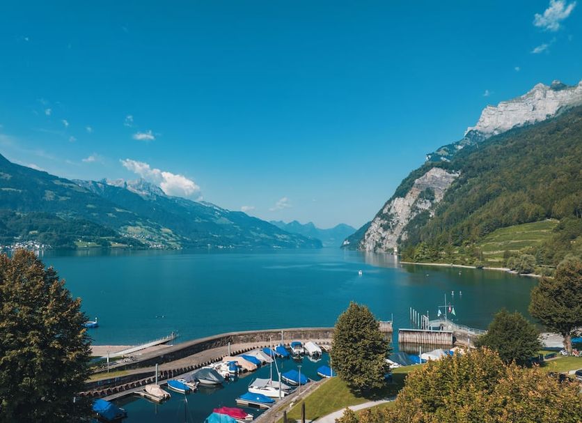 Hotel Seehof Walenstadt waterfront view over Lake Walen with marina and mountain backdrop
