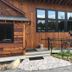 Gore Mountain Lodge in North Creek with wood exterior, ramp entrance, and cyclist outside