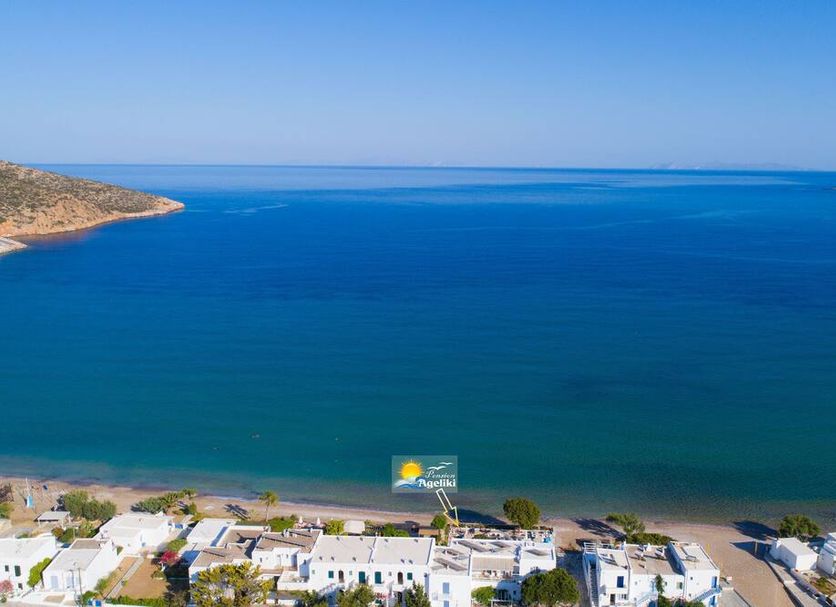 Pension Ageliki in Platis Gialos with sea view over a calm blue bay and sandy beach