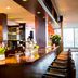 Bastion Hotel Dordrecht Papendrecht bar with long wooden counter and bar stools in Dordrecht