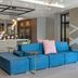 Hilton Garden Inn Sudbury lobby with blue sectional sofa, fireplace, and modern seating area