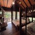 Boutique Village Hotel Krabi wood cabin room with bunk beds, double bed, and balcony view