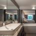 Gardina Asoke Hotel & Residence in Bangkok bathroom with freestanding tub, large mirror and walk-in shower