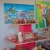 Airport X Managua display of local art, pottery and colorful paintings in a lobby area
