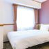 Toyoko Inn Kobe Minatogawa Koen guest room with a double bed and window in Kobe