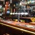Tongadale Hotel in Portree bar interior with long wooden counter, stools and beer taps