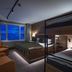 Skarsnuten Mountain Resort & Spa in Hemsedal guest room with bunk bed, armchairs and mountain view