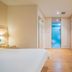 Hanting Hotel Shanghai Xujiahui Metro Station room with bed, desk, and bathroom door in Shanghai