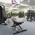 Atrium Hotel Heathrow in Hounslow gym with weight benches, dumbbell racks and mirrors