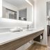 Baymont by Wyndham Arlington At Six Flags Dr room with vanity and a bed in Arlington
