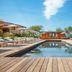Jiva Hill Resort - Genève in Crozet: outdoor pool with wooden deck, loungers and mountain view