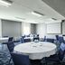 Courtyard by Marriott Kansas City Overland Park/Metcalf meeting room with round tables and projector screen