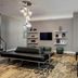 Residence Inn by Marriott Kingston Water's Edge lobby lounge with modern seating and wall-mounted TV in Kingston