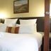 Ruslamere Hotel and Conference Centre in Durbanville guest room with king bed and wall art