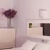 Hotel San Nikolas Sea Views in Hondarribia: bedroom with dresser, mirror, and white pillows