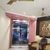 Hotel Ajay International, Agra lobby with Buddha wall art and seating near glass entrance