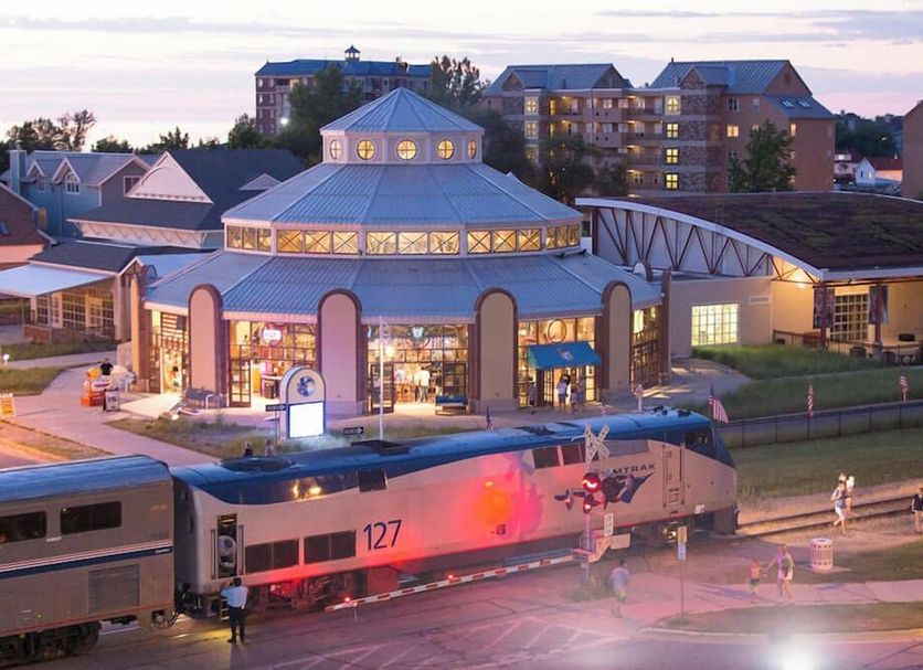 Silver Beach Hotel in Saint Joseph exterior with train passing in front at dusk