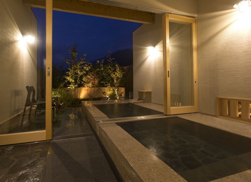 Yufuin Onsen Toshoan in Yufu: private outdoor hot spring bath with open-air night view