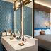 Canopy by Hilton Cancun La Isla guest room with double vanity, king bed and balcony curtains in Cancún