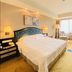 Ramada Plaza by Wyndham Tian Lu Hotel Wuhan guest room with king bed and city-view window in Wuhan