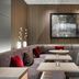 AC Hotels by Marriott Bologna lounge with curved seating and tables in a modern interior